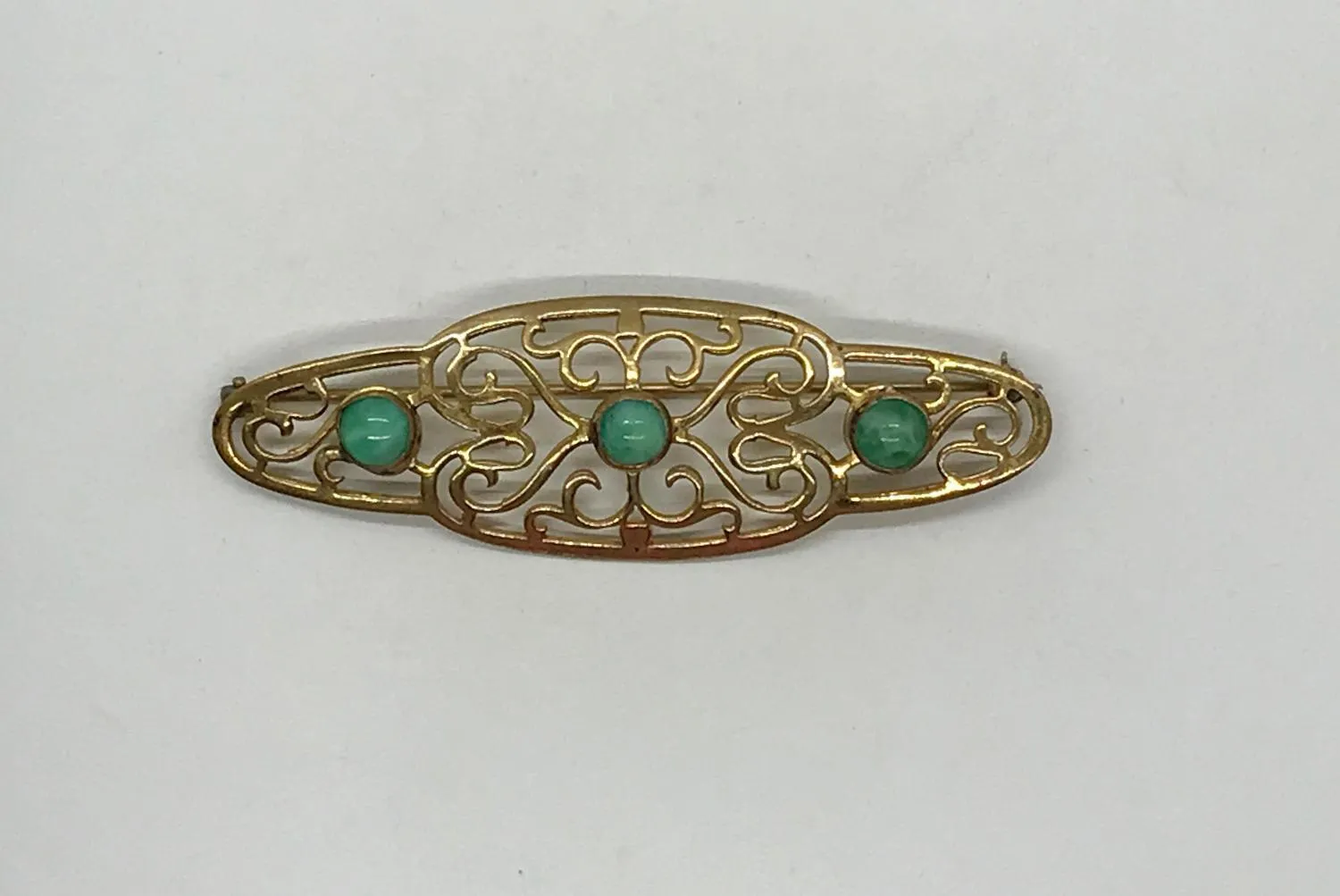 Elegant 1920s Art Deco Brooch with Green Stones