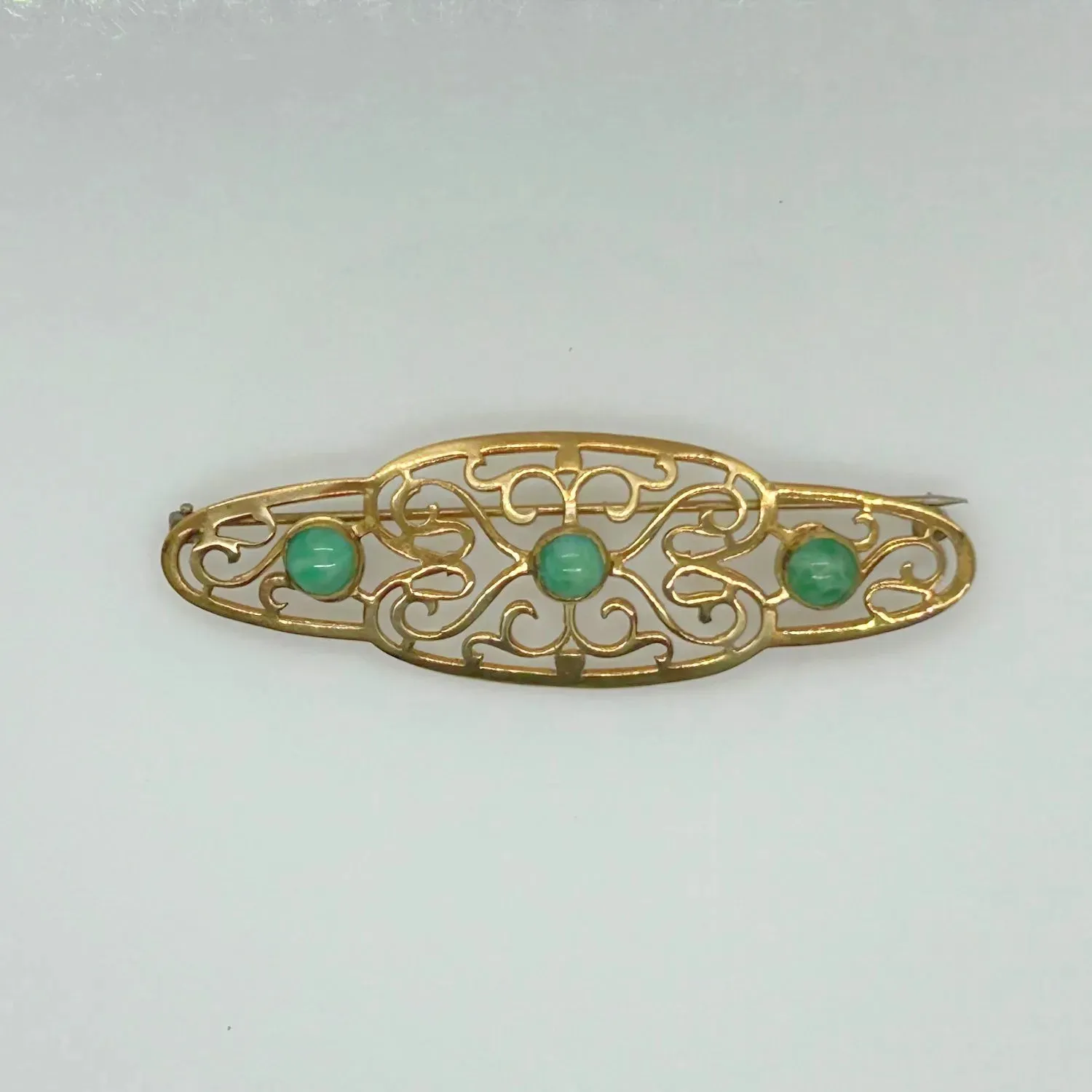 Elegant 1920s Art Deco Brooch with Green Stones